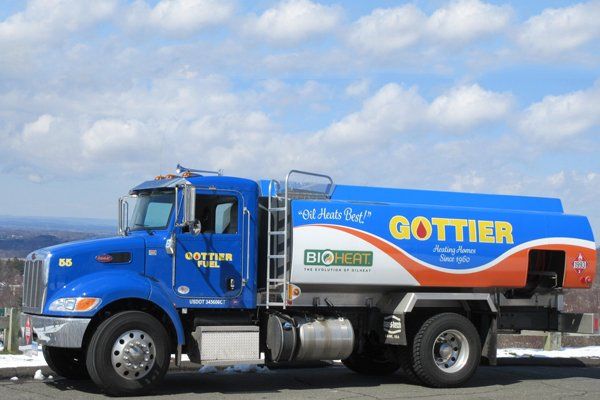 Gottier Fuel delivery truck with blue tank and orange lettering